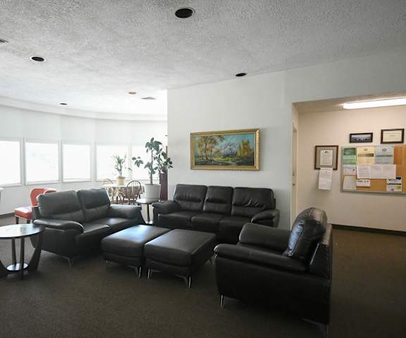 a living room with couches and chairs and a table