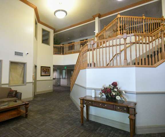 a living room with a staircase and a couch