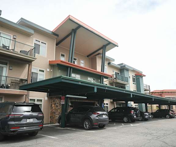 a garage with cars parked in front of a building