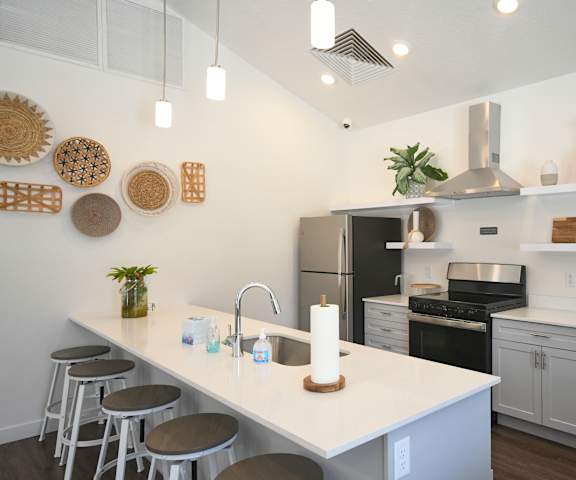 a kitchen with a large island and a counter top with stools