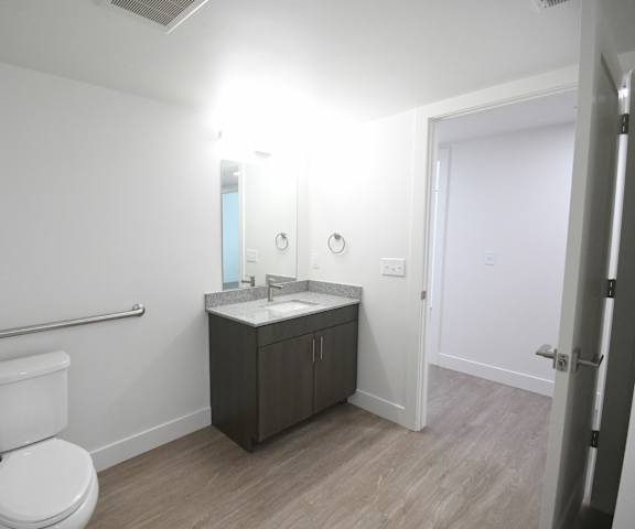 an empty bathroom with a toilet and a sink