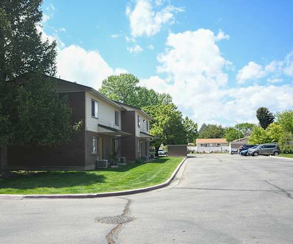 a row of houses on the corner of a street