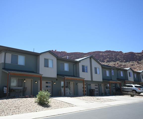 a row of houses with mountains in the background