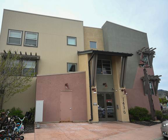the front of a building with bikes parked in front of it