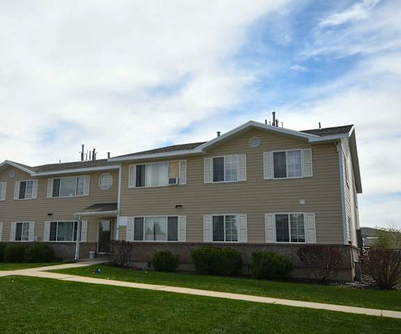 a large house with a sidewalk in front of it