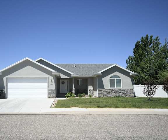 a house with a driveway and a garage door