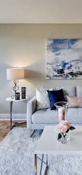 a living room with a couch and a large window