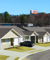 a row of houses on the side of a road