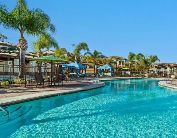Foothills at Old Town Apartments pool with poolside cabanas and surrounding sundeck