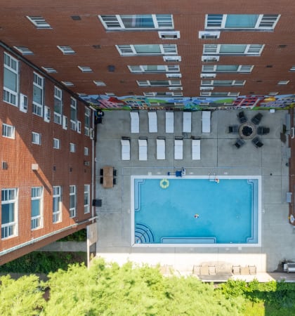 a view of the pool from the top of the building