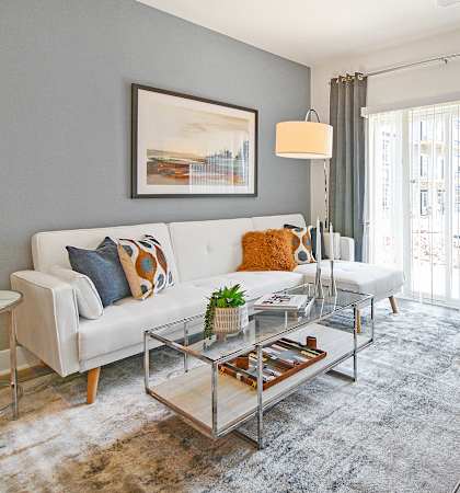a living room with gray walls and a sliding glass door