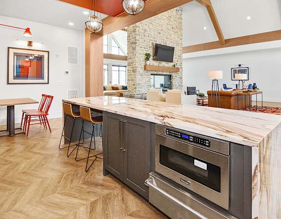 the reserve at bucklin hill clubhouse with kitchen and living room