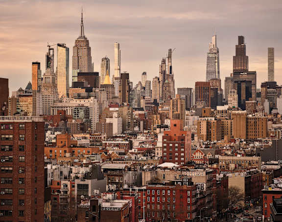 A cityscape with a mix of modern and older buildings.