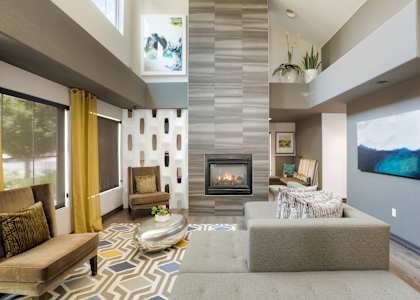 a living room with a couch and a fireplace