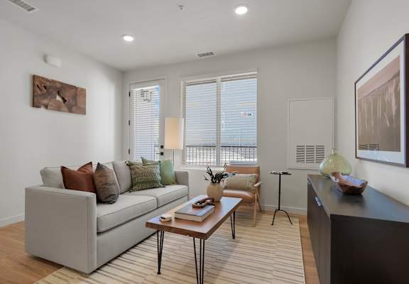 a living room with a couch and a coffee table