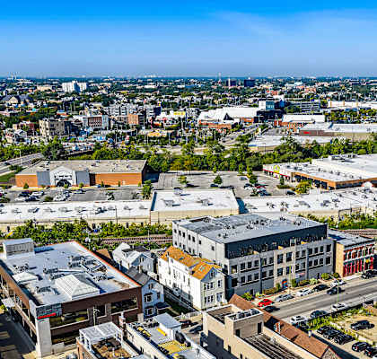 A cityscape with buildings and a clear sky.