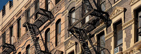 A building with a fire escape on the side.