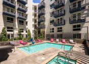 Thumbnail 1 of 44 -  pool and spa and exterior of apartment building at Topaz Apartments, Los Angeles, CA, 90013