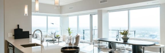 a kitchen and dining room with a view of the city