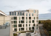 Thumbnail 5 of 7 - the facade of a building with a view of the ocean