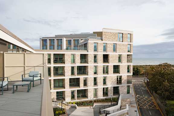 the facade of a building with a view of the ocean