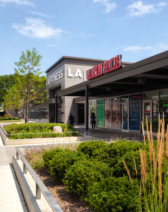 The exterior of a La Merced Poultry store with a sidewalk in front.