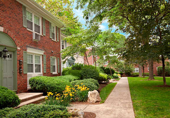 A residential street with a sidewalk and greenery. at Rivercrest Apartments, Piscataway , NJ, 08854