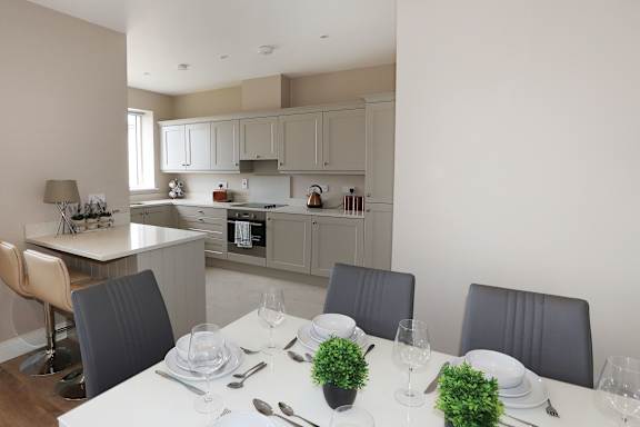 a kitchen and dining room with a table and chairs