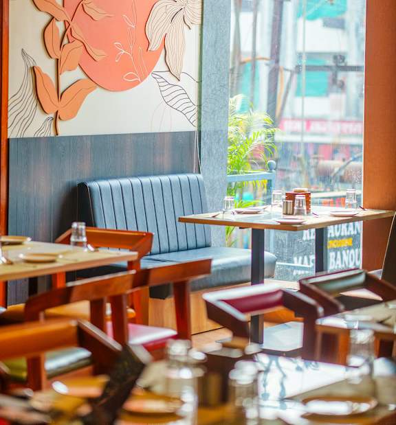 A restaurant with a large mural of a rabbit on the wall.