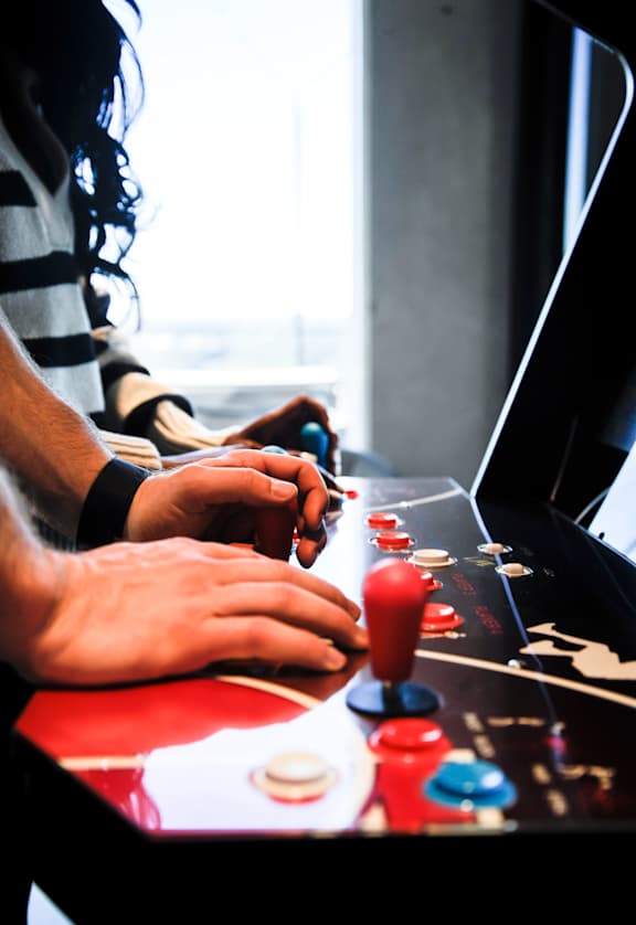 a person playing a board game on a laptop computer
