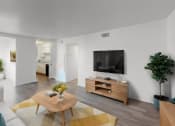 Thumbnail 5 of 18 - a living room with a couch and a table and a television