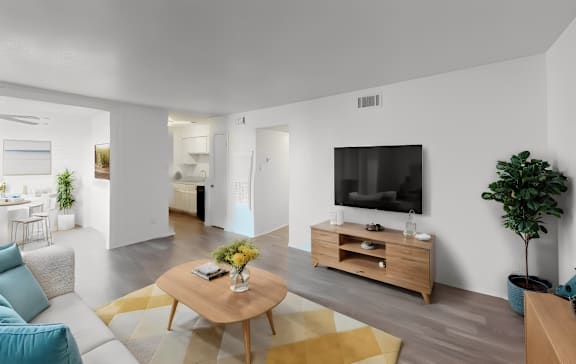 a living room with a couch and a table and a television