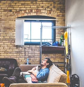 a man and a child sitting on a couch at 1033 W Loyola, Chicago, 60626