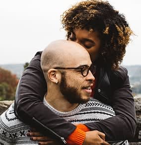 Logan Square in Chicago two people together hugging.