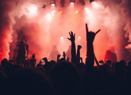 the crowd with their hands in the air at a concert at The Royale at CityPlace, Kansas