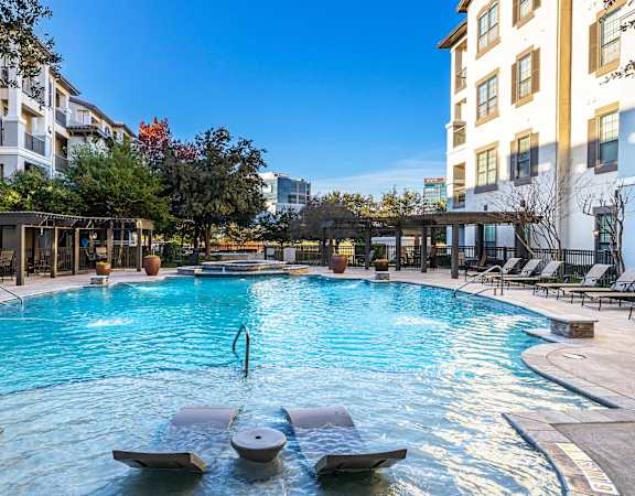 Resort-style swimming pool with sun ledge - Monterra Las Colinas