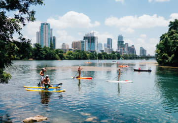 People paddle boarding on Lake Austin