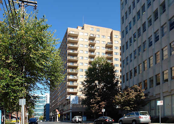 a view of a tall building on a city street