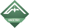 A green diamond-shaped logo with a white airplane silhouette and the text "SINCE 1921" at the bottom.