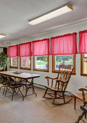 a room with a table and chairs