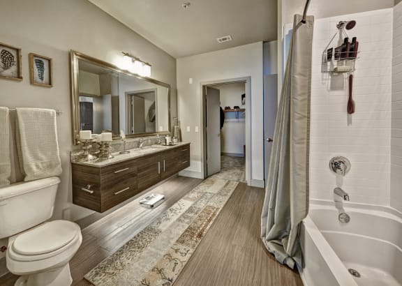 a bathroom with a toilet sink and bathtub