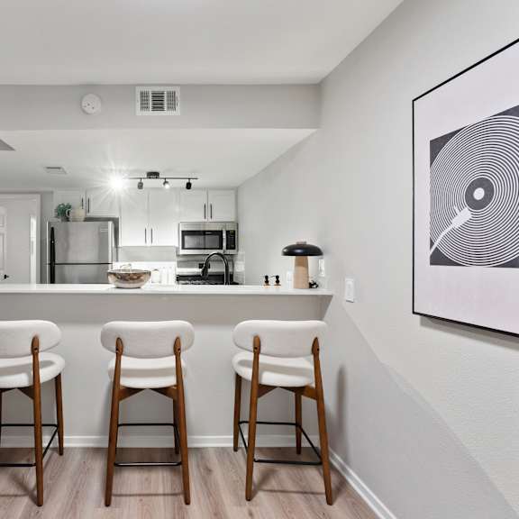 Community laundry facility with multiple machines at Creekline Apartments, Austin, 78757