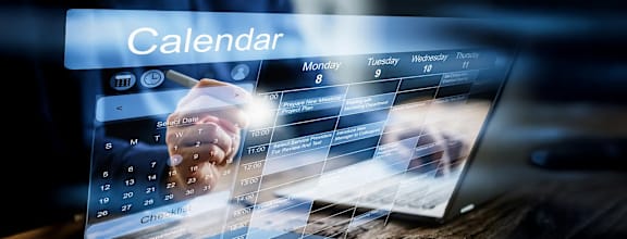 A calendar app is displayed on a laptop screen.