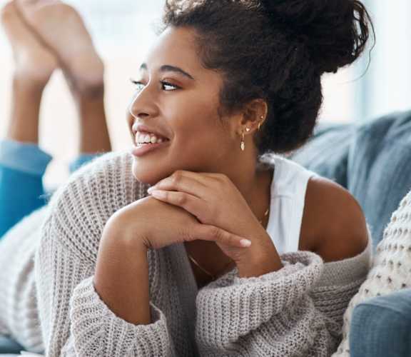 Woman on Couch at Woodmore Apartments, Bowie, Maryland