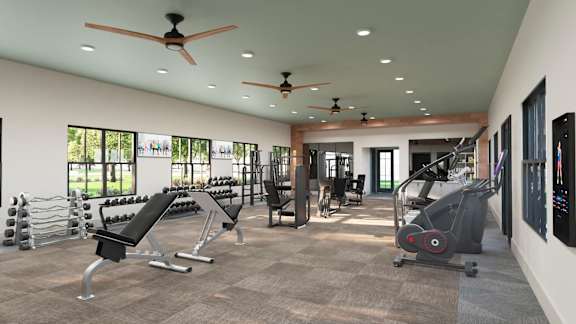 a gym with treadmills and other exercise equipment in a building with windows at The Quinn, Pensacola, FL, 32526