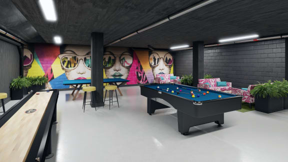 a pool table and ping pong table in the games room
