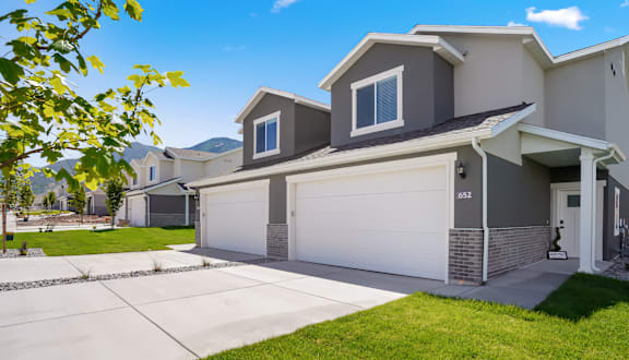 A modern house with a garage and a driveway.