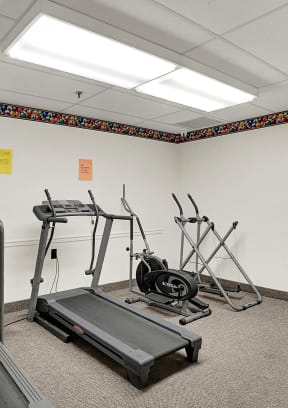 a fitness room with treadmills | Lancaster House North | Apartments in Lancaster