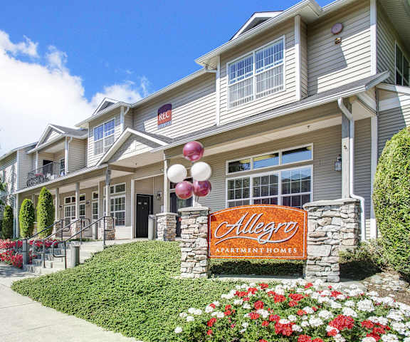 The front entrance and sign at Allegro Apartment Homes. 