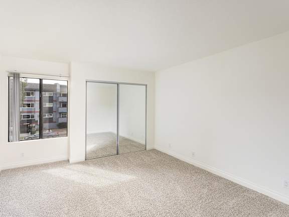 Room with a Carpeted Floor at Northridge Gardens Apartments, Northridge, CA, 91325
